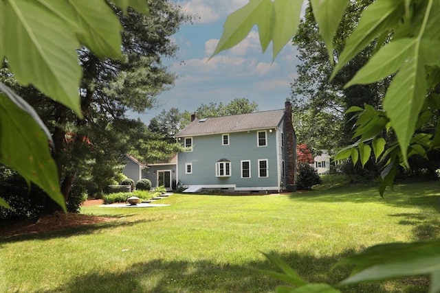 1 Ridgeway Rd, North Reading, MA 01864 - rear view of house with a lawn and a chimney
