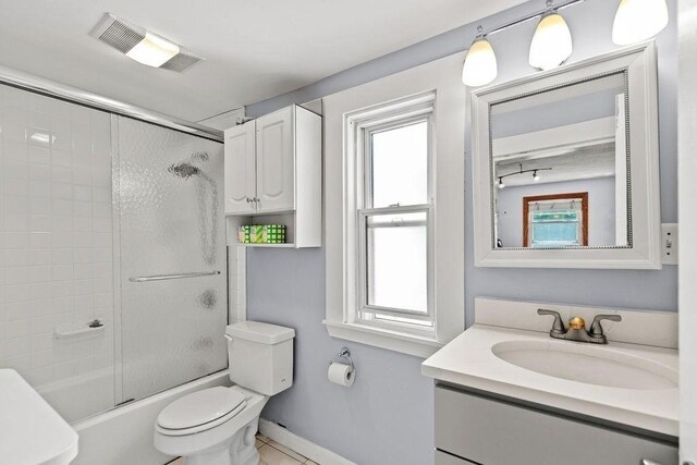 42 Carolina Ave, Boston, MA 02130 - bathroom with toilet, vanity, bath / shower combo with glass door, and plenty of natural light