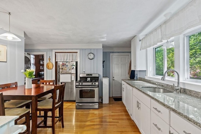 42 Carolina Ave, Boston, MA 02130 - kitchen featuring freestanding refrigerator, gas stove, a sink, dishwashing machine, and healthy amount of natural light