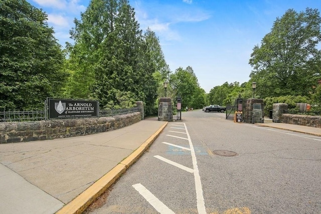 42 Carolina Ave, Boston, MA 02130 - view of asphalt road featuring sidewalks, street lights, curbs, and a gated entry