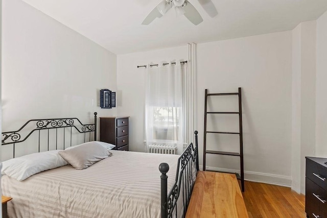 42 Carolina Ave, Boston, MA 02130 - bedroom featuring radiator heating unit, wood finished floors, baseboards, and ceiling fan