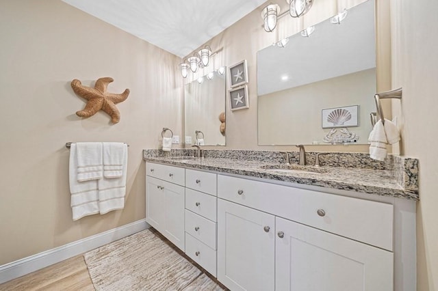 bathroom featuring hardwood / wood-style floors and vanity