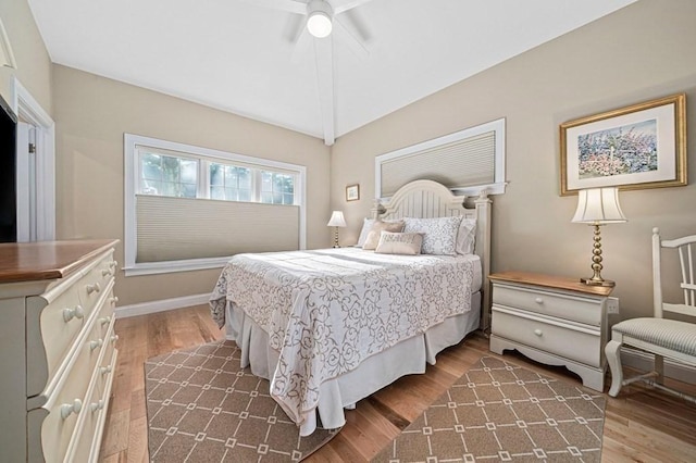 bedroom featuring dark hardwood / wood-style flooring and ceiling fan