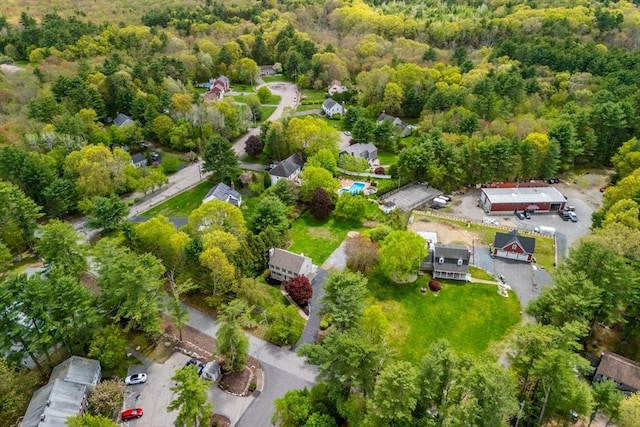 view of property location with a heavily wooded area