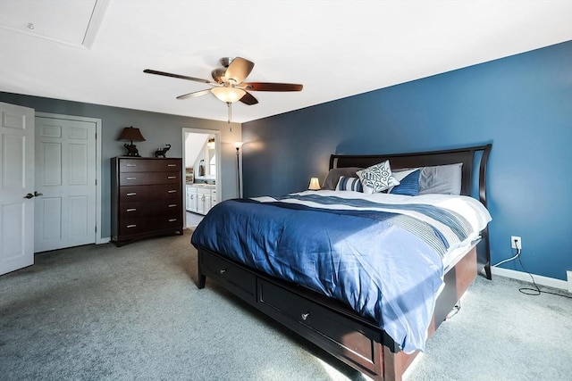 bedroom featuring a ceiling fan, carpet, baseboards, and ensuite bathroom