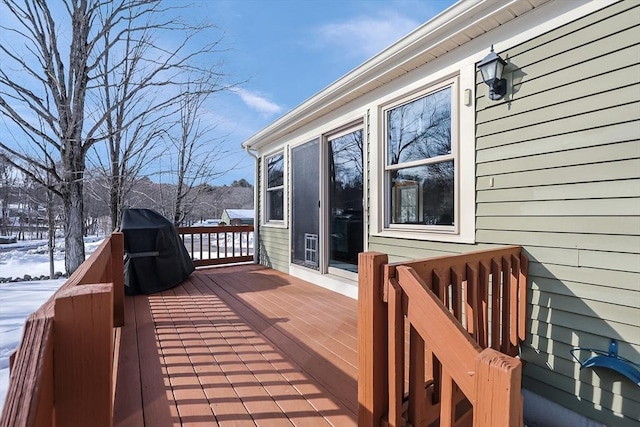 view of snow covered deck