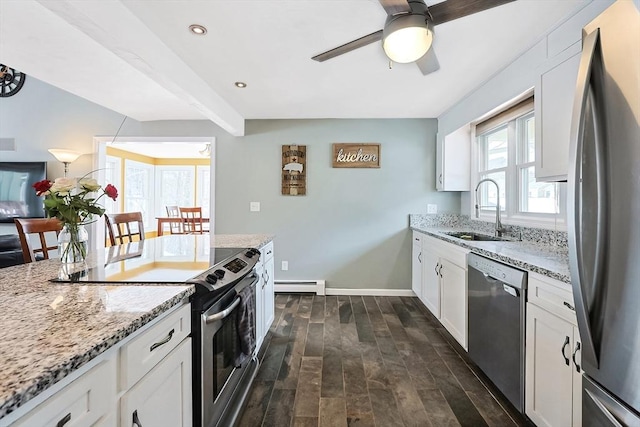 kitchen featuring dark wood-style flooring, light stone countertops, stainless steel appliances, a baseboard heating unit, and a sink