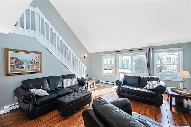 living area with wood-type flooring, stairs, a baseboard heating unit, and baseboards