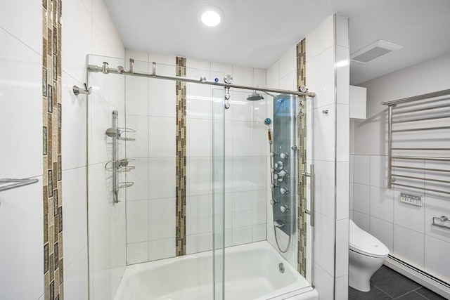 52 Nourse St, Westborough, MA 01581 - bathroom featuring baseboard heating, bath / shower combo with glass door, radiator, tile walls, and tile patterned floors
