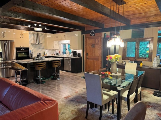 52 Nourse St, Westborough, MA 01581 - dining space with a wood ceiling with exposed beams and light wood-style floors
