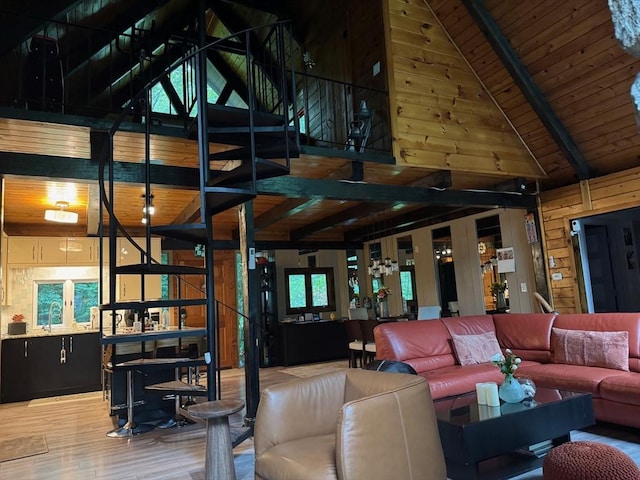 52 Nourse St, Westborough, MA 01581 - living area with wood finished floors, beam ceiling, high vaulted ceiling, and wood walls