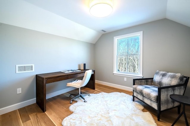 office space with lofted ceiling and hardwood / wood-style floors