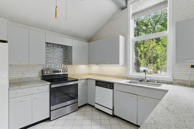2 Hillside Dr Unit 2, Wayland, MA 01778 - kitchen featuring white appliances, a sink, vaulted ceiling, plenty of natural light, and decorative backsplash