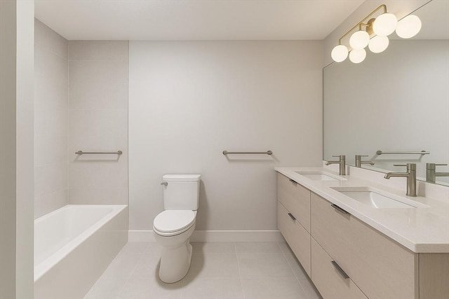 2 Hillside Dr Unit 2, Wayland, MA 01778 - bathroom with tile patterned floors, double vanity, toilet, baseboards, and  shower combination