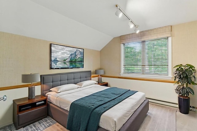 2 Hillside Dr Unit 2, Wayland, MA 01778 - bedroom with track lighting, wood finished floors, and vaulted ceiling