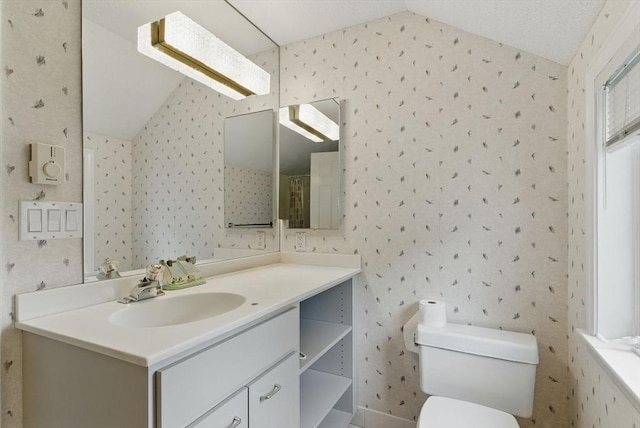 2 Hillside Dr Unit 2, Wayland, MA 01778 - full bathroom featuring vaulted ceiling, wallpapered walls, vanity, toilet, and a shower with curtain