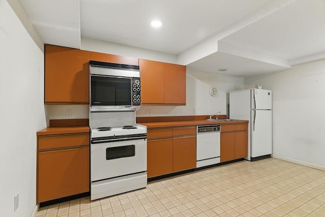 2 Hillside Dr Unit 2, Wayland, MA 01778 - kitchen with white appliances, a sink, recessed lighting, and baseboards