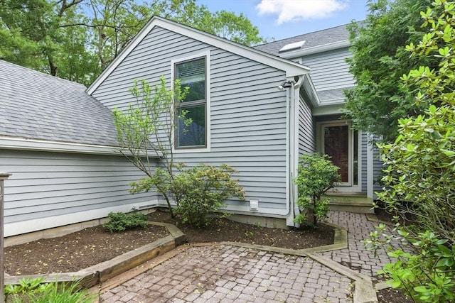 2 Hillside Dr Unit 2, Wayland, MA 01778 - view of side of property with a patio area and roof with shingles