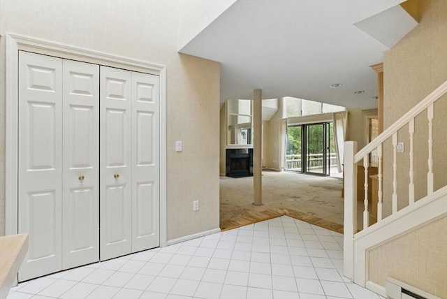 2 Hillside Dr Unit 2, Wayland, MA 01778 - tiled foyer featuring a baseboard radiator, stairs, carpet floors, and baseboards