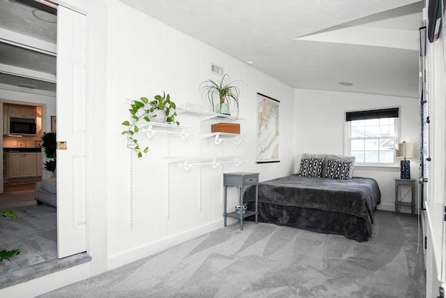 bedroom with light carpet, baseboards, and visible vents