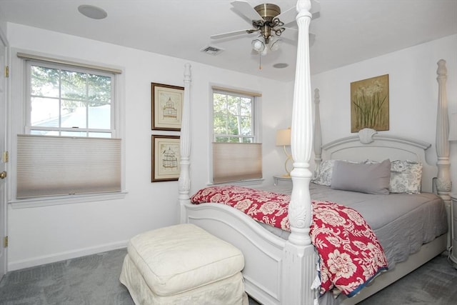 carpeted bedroom with ceiling fan, visible vents, and baseboards