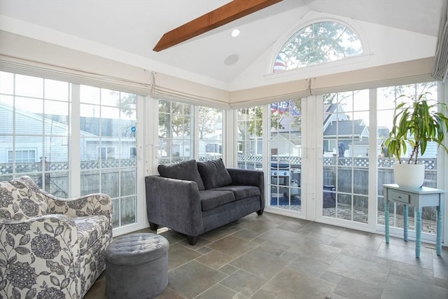 sunroom with lofted ceiling with beams