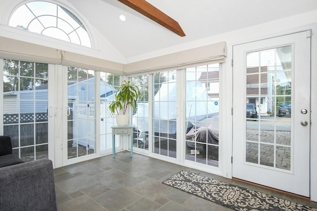 sunroom / solarium featuring vaulted ceiling with beams and a wealth of natural light