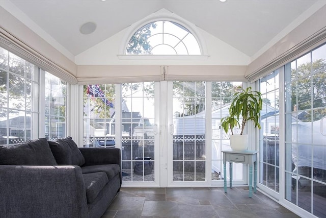 sunroom featuring lofted ceiling