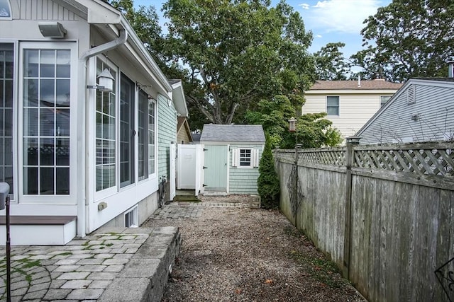 view of yard with a fenced backyard and an outdoor structure