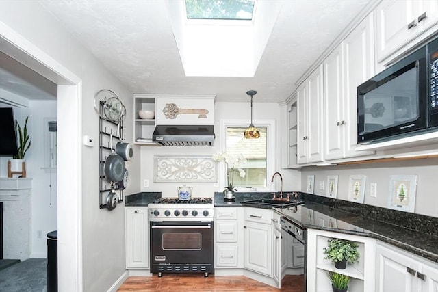 kitchen featuring white cabinets, a sink, black appliances, and open shelves