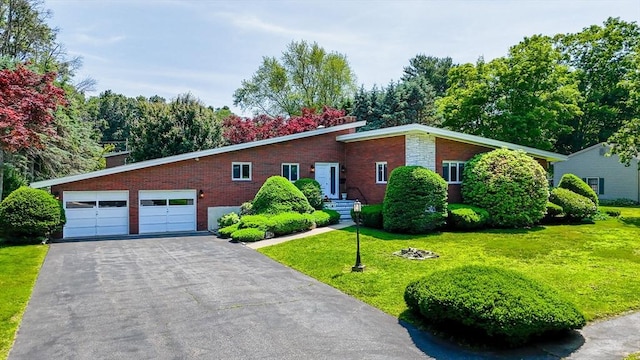 9 Seneca Dr, Danvers, MA 01923 - mid-century home with brick siding, a front yard, a garage, asphalt driveway, and a chimney