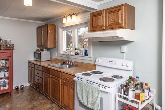 kitchen with brown cabinets, white range with electric stovetop, a sink, stainless steel microwave, and under cabinet range hood