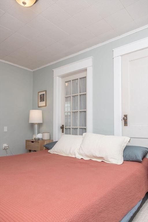 bedroom with ornamental molding
