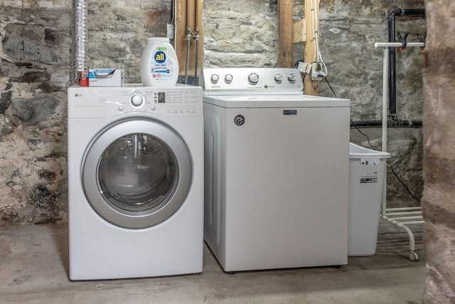 clothes washing area with laundry area and washer and clothes dryer