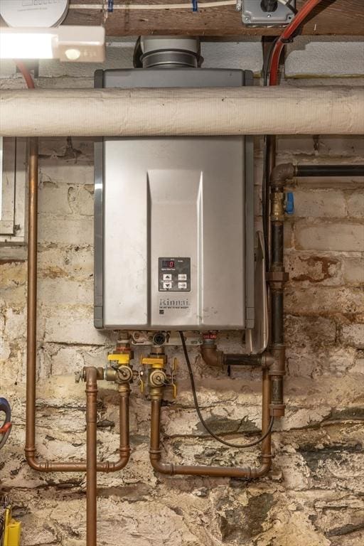 utility room with water heater