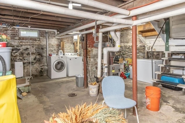 basement featuring washer and dryer and fridge