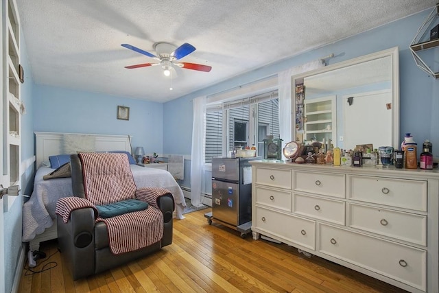 298 Oakland Rd, Barnstable, MA 02601 - bedroom featuring light wood-style flooring, a textured ceiling, and ceiling fan