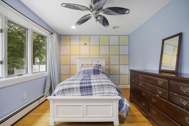 298 Oakland Rd, Barnstable, MA 02601 - bedroom featuring a baseboard heating unit, light wood-type flooring, recessed lighting, and a ceiling fan
