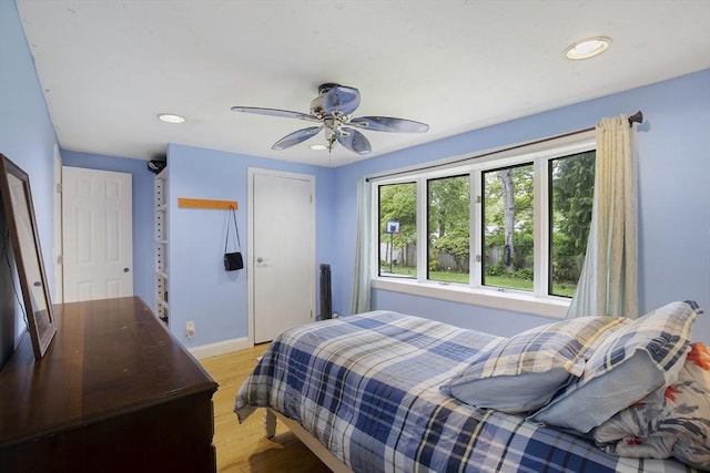 298 Oakland Rd, Barnstable, MA 02601 - bedroom featuring recessed lighting, light wood-style flooring, a closet, baseboards, and ceiling fan