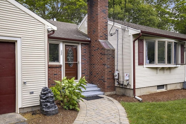 298 Oakland Rd, Barnstable, MA 02601 - doorway to property featuring a chimney and roof with shingles