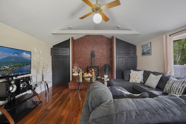 298 Oakland Rd, Barnstable, MA 02601 - living area with wood finished floors, vaulted ceiling, a wood stove, and ceiling fan