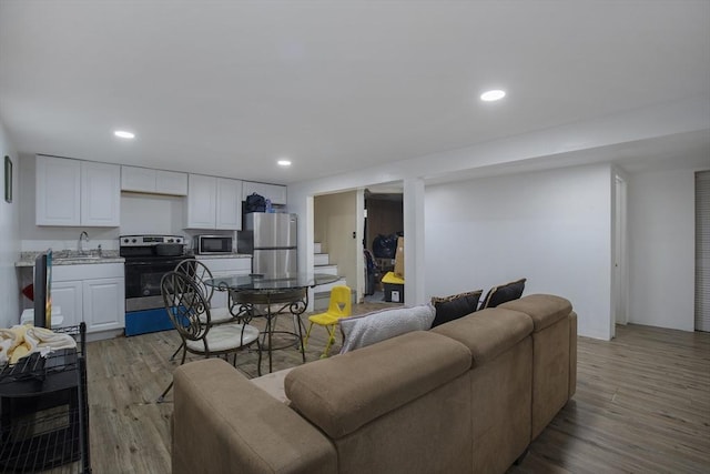 298 Oakland Rd, Barnstable, MA 02601 - living area featuring light wood-style floors, recessed lighting, and stairway