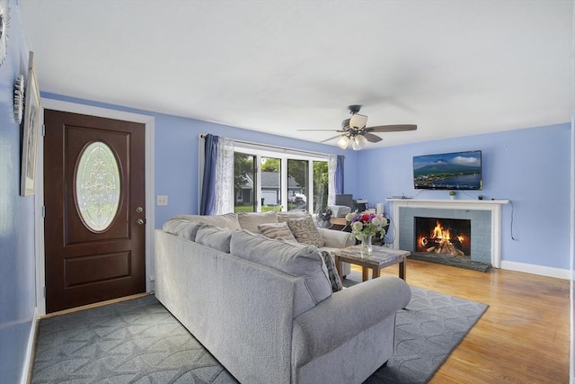 298 Oakland Rd, Barnstable, MA 02601 - living area featuring light wood-style floors, a brick fireplace, ceiling fan, and baseboards