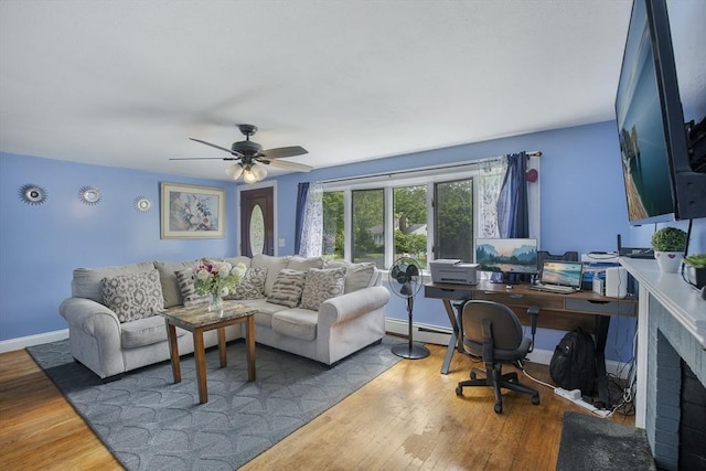 298 Oakland Rd, Barnstable, MA 02601 - living area featuring a baseboard heating unit, wood finished floors, a ceiling fan, and baseboards