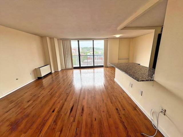 60 Longwood Ave Unit 802, Brookline, MA 02446 - unfurnished living room with expansive windows and wood finished floors
