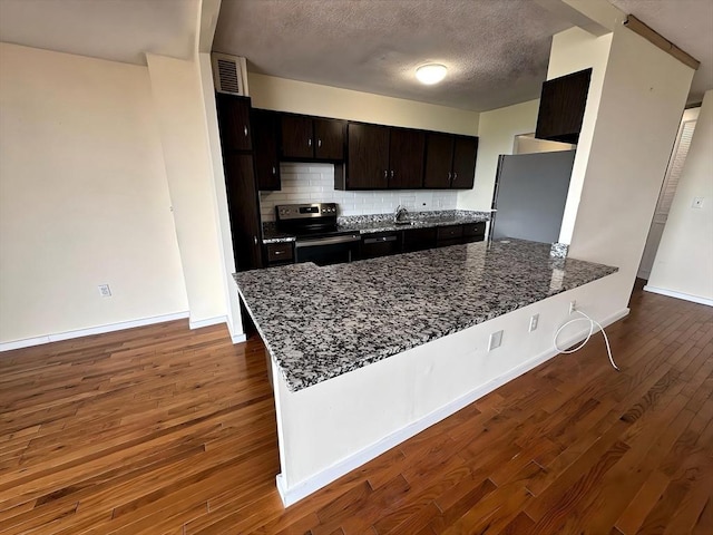 60 Longwood Ave Unit 802, Brookline, MA 02446 - kitchen featuring electric range, freestanding refrigerator, a peninsula, dark wood-style flooring, and dark stone counters