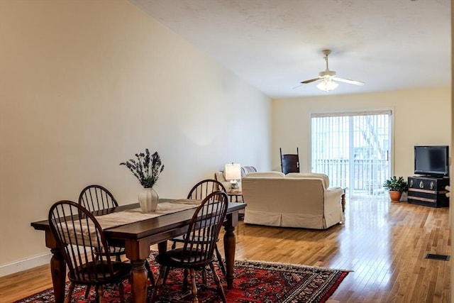 dining space featuring ceiling fan and hardwood / wood-style floors