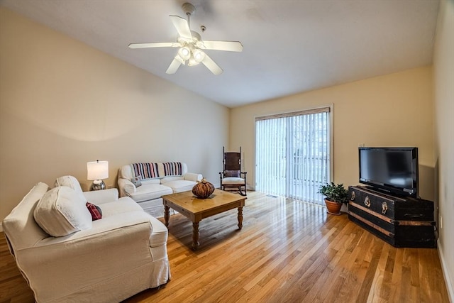 living room featuring ceiling fan and light hardwood / wood-style flooring