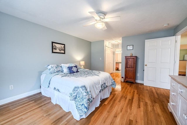 bedroom with ceiling fan, a closet, and light wood-type flooring