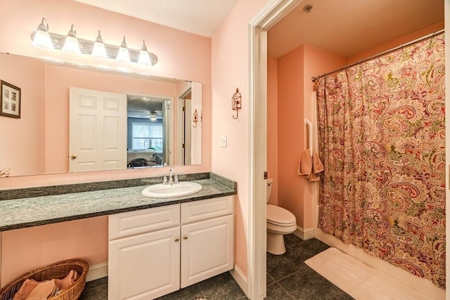 bathroom with vanity, a shower with shower curtain, and toilet